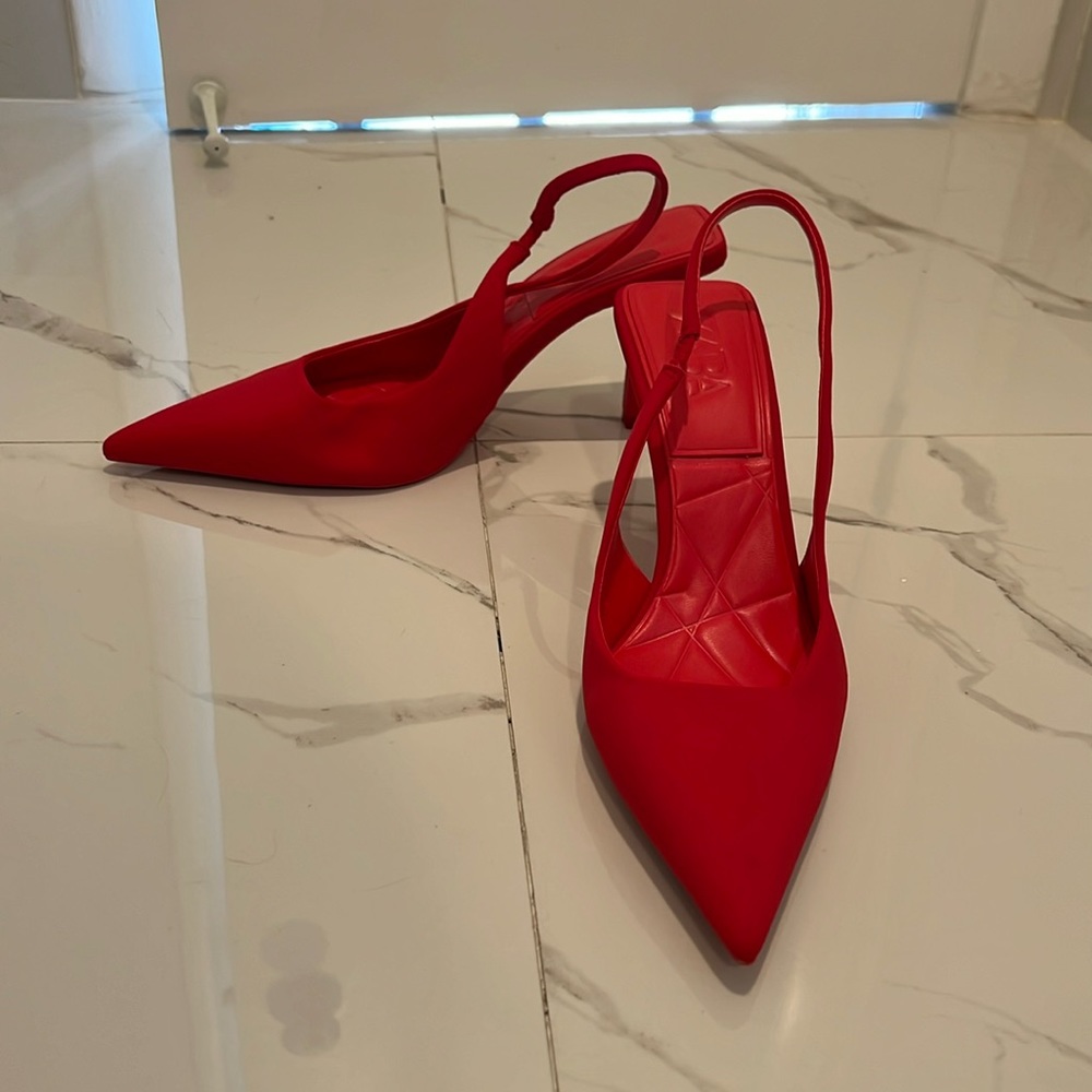 Red pointed toe heels